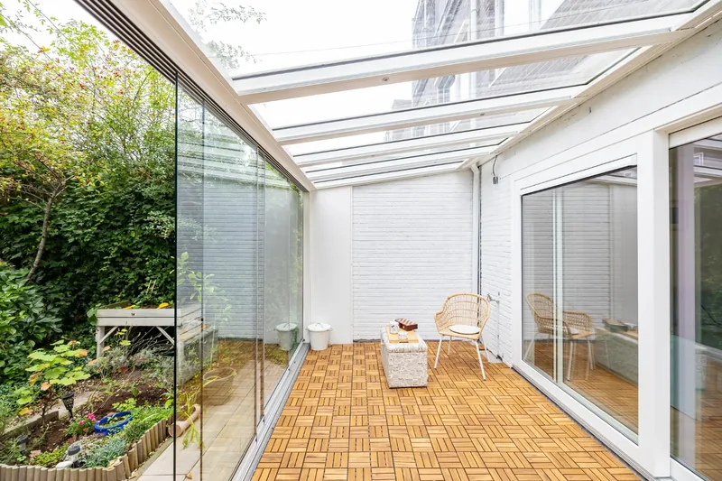 Before: From the garden: glass conservatory to extension