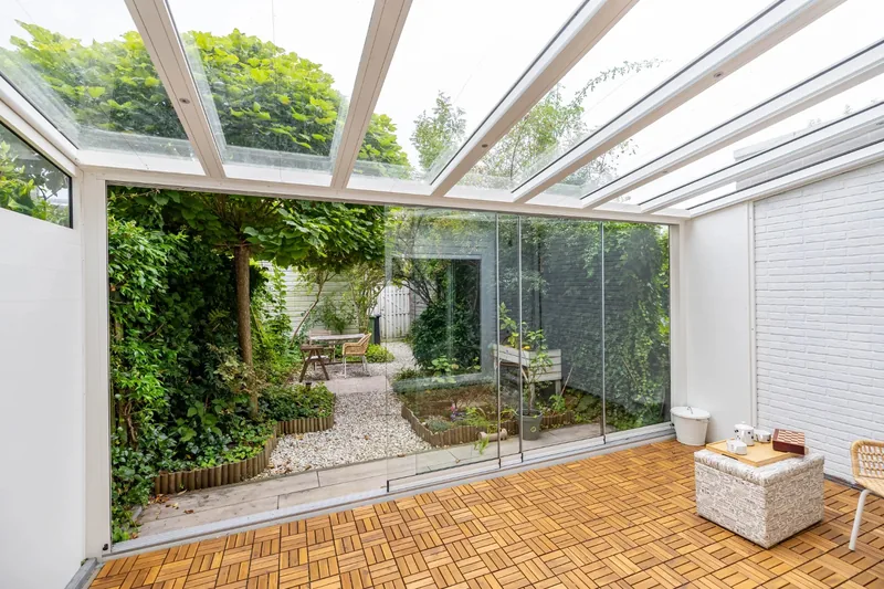 Before: Conservatory to bright living room with sliding doors
